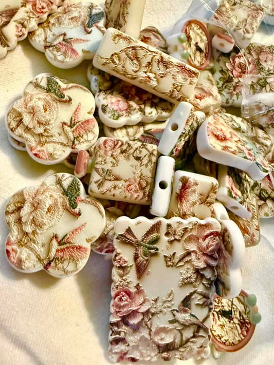 Birds with flowers beads and pendants on an ivory white (w/2 hole beads)