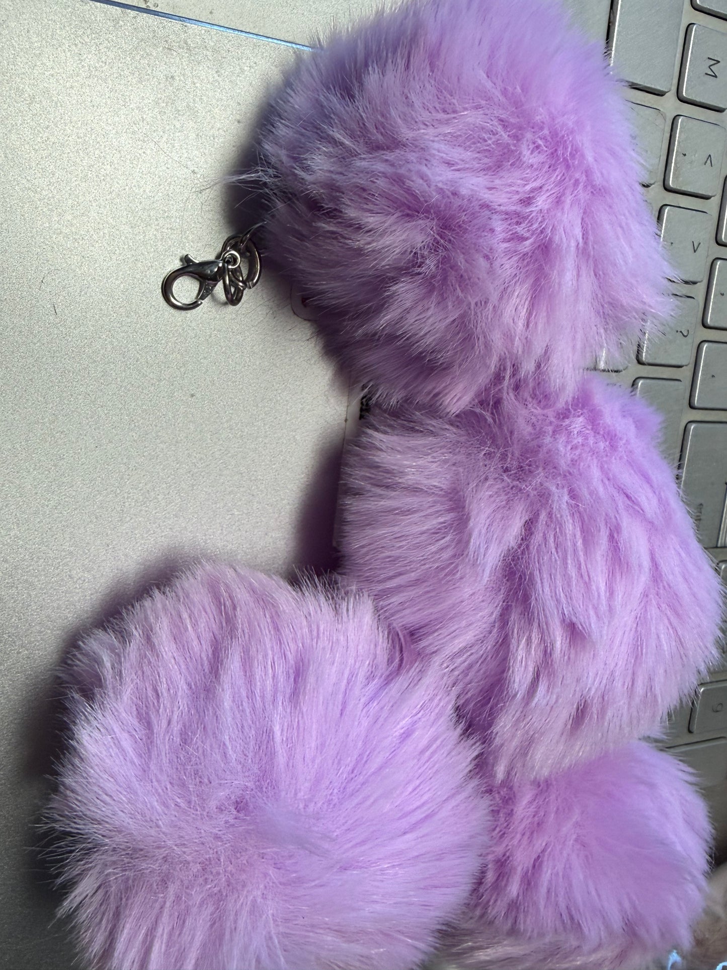 3" Fuffy pompom with chain and lobster claw hardware.