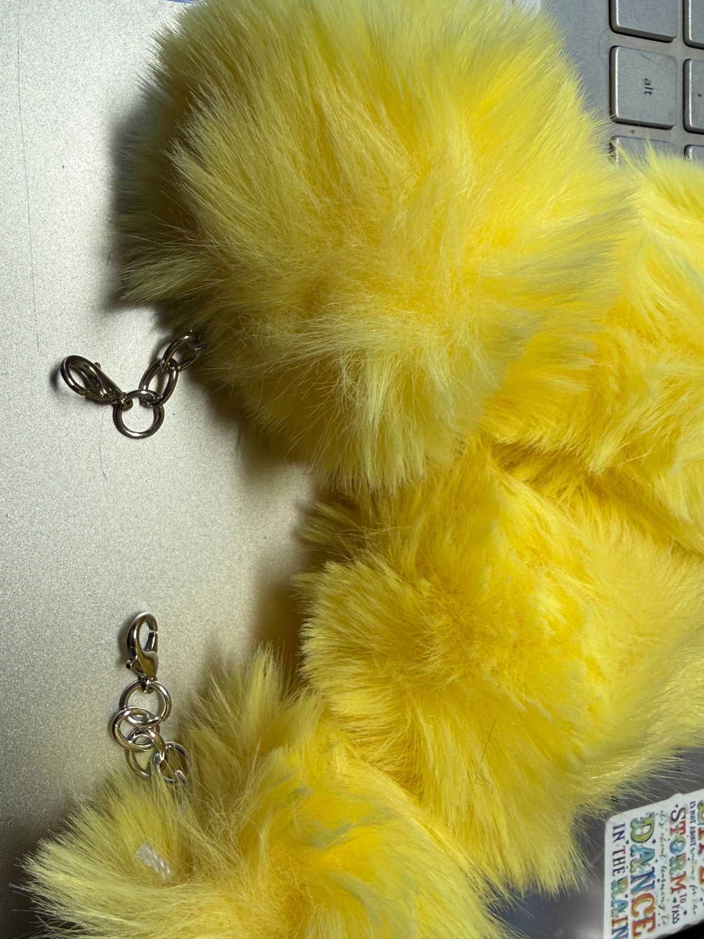 3" Fuffy pompom with chain and lobster claw hardware.