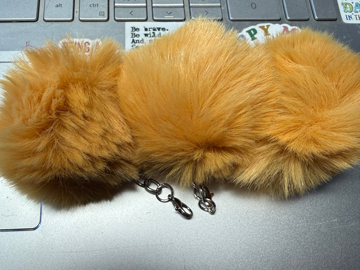 3" Fuffy pompom with chain and lobster claw hardware.