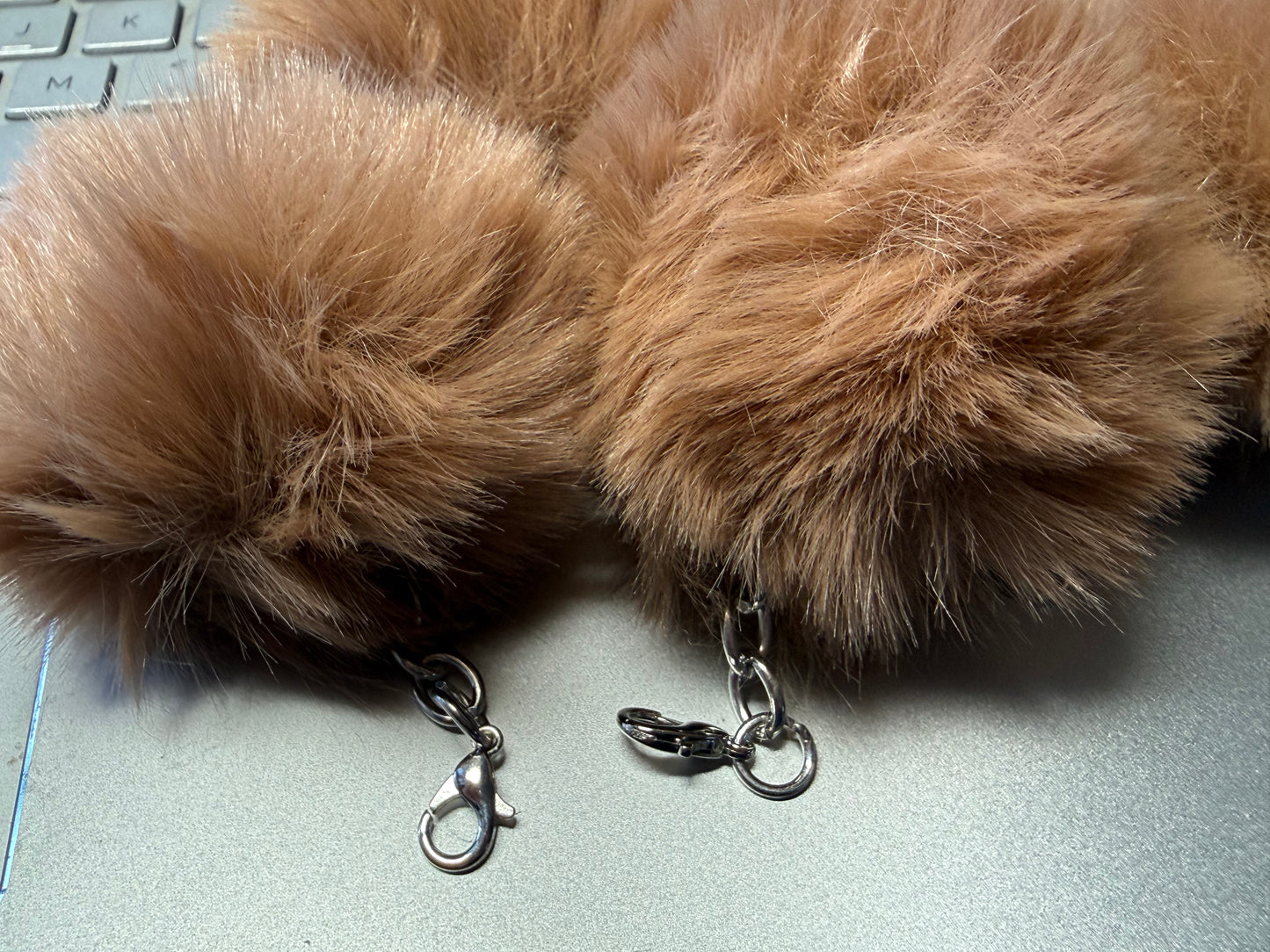 3" Fuffy pompom with chain and lobster claw hardware.