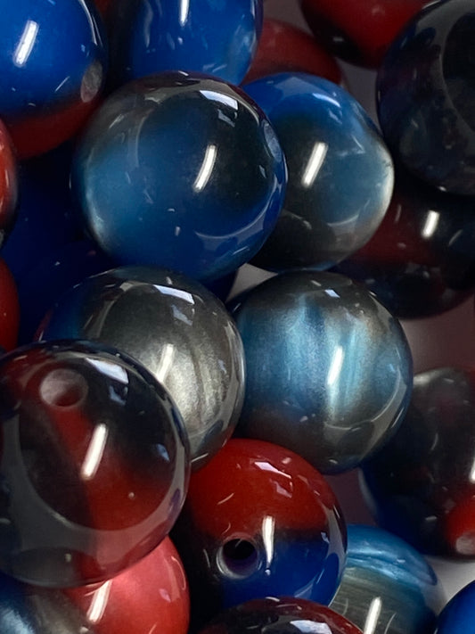 16mm cat’s eye black, red, and blue beads